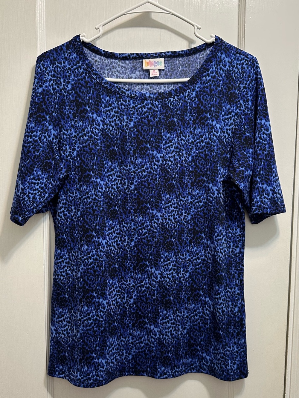 LuLaRoe: M Blue and Black Leopard Print Top